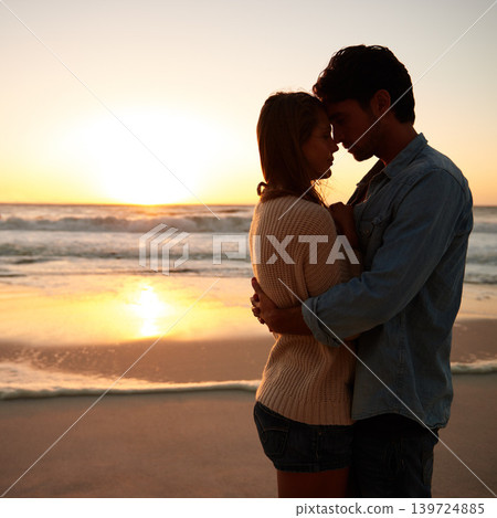 Couple, hug and love on beach at sunset for bonding marriage or vacation, weekend or peace. Man, woman and embrace on sea sand for calm on tropical holiday for coast adventure, summer or mockup space Couple, hug and love on beach at sunset for bonding marriage or vacation, weekend or peace. Man, woman and embrace on sea sand for calm on tropical holiday for coast adventure, summer or mockup space 139724885
