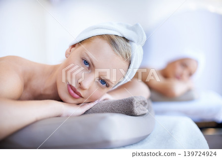 Spa, portrait and women lying on table for skincare, beauty and luxury treatment for wellness. People, relax and face of calm person on bed in salon or hotel for massage or dermatology care for body Spa, portrait and women lying on table for skincare, beauty and luxury treatment for wellness. People, relax and face of calm person on bed in salon or hotel for massage or dermatology care for body 139724924