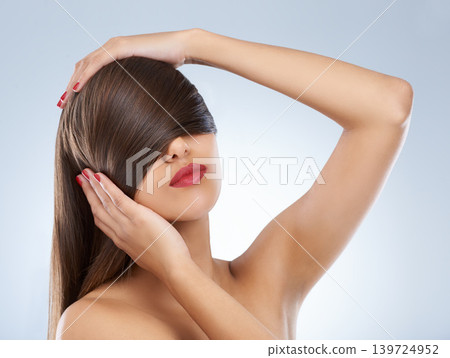 Face, beauty and hair of woman at salon in studio on white background for keratin treatment. Hands, nails and manicure with confident young haircare model for shampoo, cosmetics or hairdressing Face, beauty and hair of woman at salon in studio on white background for keratin treatment. Hands, nails and manicure with confident young haircare model for shampoo, cosmetics or hairdressing 139724952
