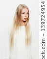 Woman, natural and beauty in haircare, cosmetics or makeup on a white studio background. Face of young female person, blonde or attractive model with long healthy hairstyle, glow or shine on mockup 139724954