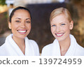 Portrait, smile and friends at spa for beauty, therapy and skincare treatment for wellness. Face, happy women and salon to relax, luxury pamper and diverse girls together at outdoor resort for health 139724959