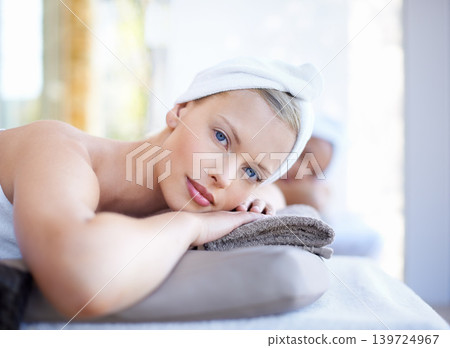 Woman, relax and portrait lying on table in spa for skincare, beauty and luxury treatment for wellness. People, rest and face of calm person on bed in hotel for massage or dermatology care for body Woman, relax and portrait lying on table in spa for skincare, beauty and luxury treatment for wellness. People, rest and face of calm person on bed in hotel for massage or dermatology care for body 139724967
