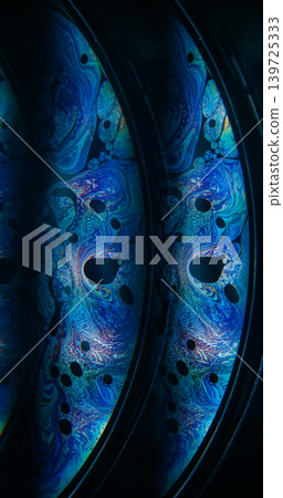 Oil spill. Psychedelic texture. Blur blue purple color ink chemical round drop floating on abstract dark black creative background. Oil spill. Psychedelic texture. Blur blue purple color ink chemical round drop floating on abstract dark black creative background. 139725333