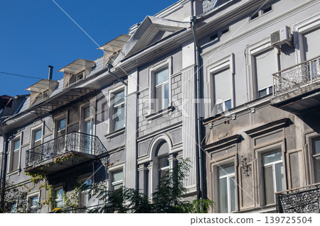 European Row House Facade with Balconies on Sunny European Row House Facade with Balconies on Sunny 139725504