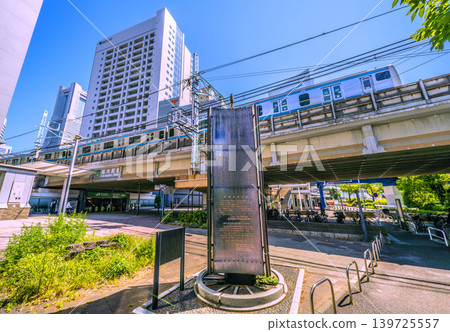 A view of Yokohama, Japan, including the "Railway Founding Site Monument" in front of the new south exit of Sakuragicho Station, and the Yokohama Landmark Tower. 139725557
