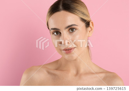 Elegant portrait of beautiful young woman with glowing skin and natural makeup Elegant portrait of beautiful young woman with glowing skin and natural makeup 139725615