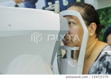 Phoropter for eye test, lenses glasses for eye check in optical store.  139725770