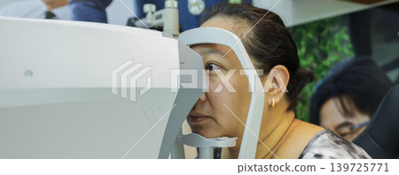 Phoropter for eye test, lenses glasses for eye check in optical store.  139725771