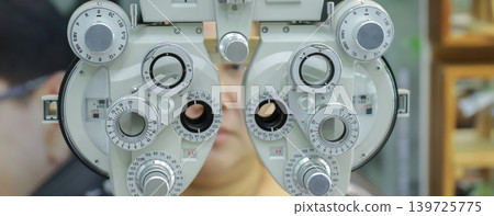 Phoropter for eye test, lenses glasses for eye check in optical store. Phoropter for eye test, lenses glasses for eye check in optical store. 139725775