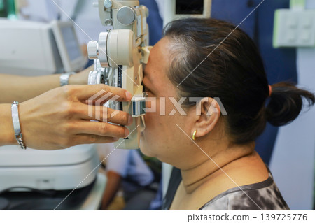 Phoropter for eye test, lenses glasses for eye check in optical store. Phoropter for eye test, lenses glasses for eye check in optical store. 139725776