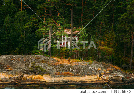 Hidden Red Wooden Cabin in a Finnish Pine Forest Hidden Red Wooden Cabin in a Finnish Pine Forest 139726680