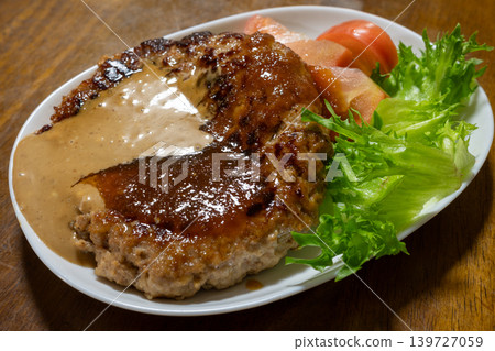 A very delicious tofu hamburger steak from a typical Japanese home. A very delicious tofu hamburger steak from a typical Japanese home. 139727059