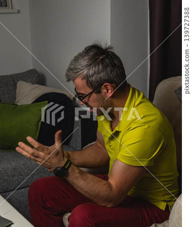 Frustrated man reacting to bad news on smartphone 139727388