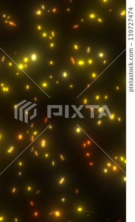 Floating golden spark particles on a dark background, creating a warm abstract glow with festive energy and atmospheric depth 139727474