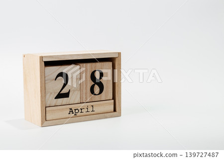 Wooden calendar April 28 on a white background 139727487