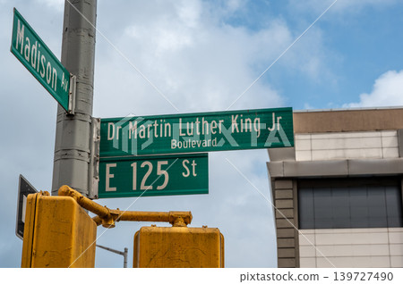 New york, usa august 18,2024. Street signs for martin luther king jr boulevard, madison avenue, and e 125th street intersecting in harlem, new york city New york, usa august 18,2024. Street signs for martin luther king jr boulevard, madison avenue, and e 125th street intersecting in harlem, new york city 139727490
