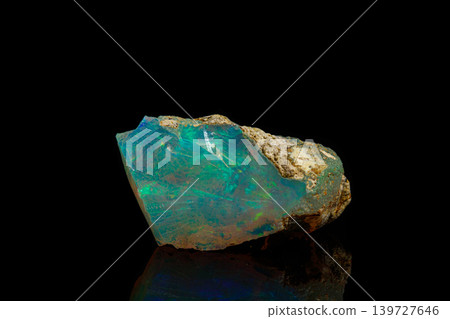macro mineral stone rare and beautiful opals on a black background 139727646