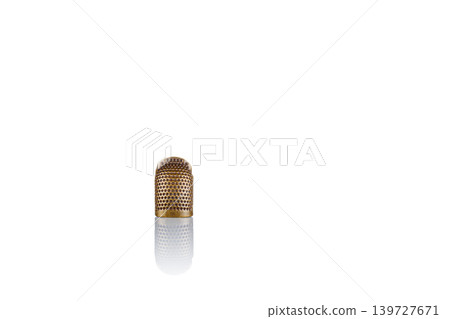 thimble and needle and thread on a white background thimble and needle and thread on a white background 139727671