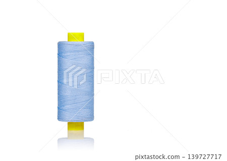 a skein of threads of blue color macro on a white background a skein of threads of blue color macro on a white background 139727717