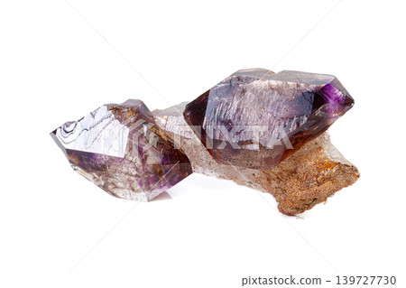 macro mineral stone Amethyst on smoky quartz on a white background macro mineral stone Amethyst on smoky quartz on a white background 139727730