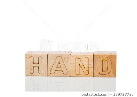 Wooden cubes with letters hand on a white background Wooden cubes with letters hand on a white background 139727783