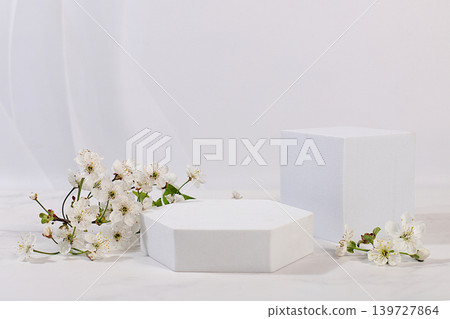 Empty product podium and fresh live spring flowers.Abstract beautiful flower arrangement with cherry blossoms,banner.Stage for business concept.Minimal modern aesthetics and elegant beauty concept Empty product podium and fresh live spring flowers.Abstract beautiful flower arrangement with cherry blossoms,banner.Stage for business concept.Minimal modern aesthetics and elegant beauty concept 139727864