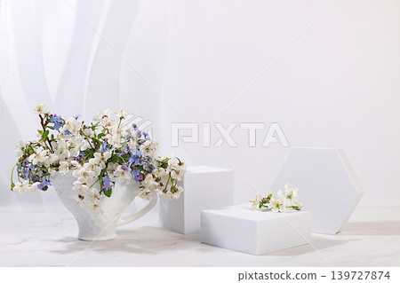Empty product podium and fresh live spring flowers.Abstract beautiful flower arrangement with cherry blossoms,banner.Stage for business concept.Minimal modern aesthetics and elegant beauty concept Empty product podium and fresh live spring flowers.Abstract beautiful flower arrangement with cherry blossoms,banner.Stage for business concept.Minimal modern aesthetics and elegant beauty concept 139727874