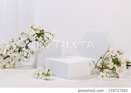 Beautiful banner with cherry blossoms and empty, varied product display stands, design template and a display. Abstract floral arrangement for a product display business card,Minimal modern aesthetics 139727883