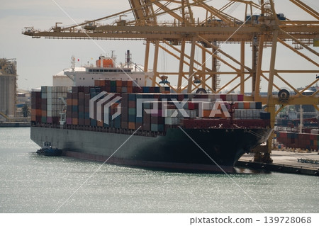 Container ship at port terminal with gantry cranes. Barcelona, Spain 139728068