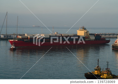 Container ship escorted by tugboats in port harbor Container ship escorted by tugboats in port harbor 139728069