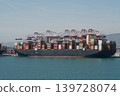 Large container ship at terminal with red gantry cranes 139728074