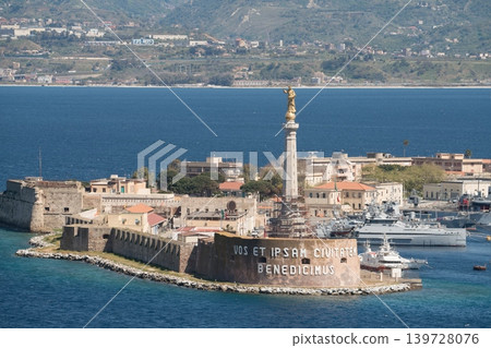 Madonna della Lettera statue over Messina harbor and historic fortress. Messina, Sicily, Italy Madonna della Lettera statue over Messina harbor and historic fortress. Messina, Sicily, Italy 139728076