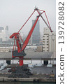 Red portal harbor crane at industrial port terminal 139728082