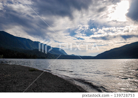 Dramatic Storm Clouds Passing over Caltus Lake and Mountain Landscape 139728753