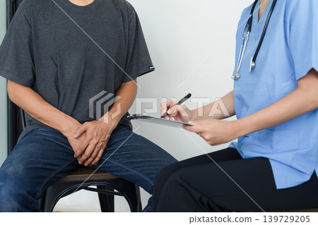 Male doctor and testicular cancer patient discuss the test results. Testicular cancer and prostate cancer concept 139729205