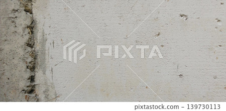 Close-up image of a white plaster wall with a rough texture and surface details like natural semen. Close-up image of a white plaster wall with a rough texture and surface details like natural semen. 139730113
