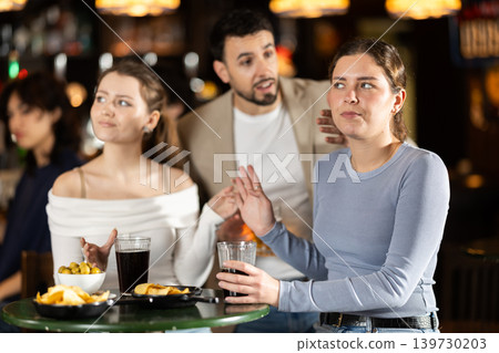 Young man flirting with two women getting rejected Young man flirting with two women getting rejected 139730203