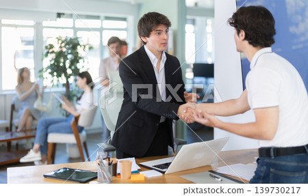 Bank manager talking with male client in office 139730217