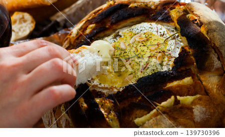 Image of camembert cheesemelted in bread, french dish at plate 139730396
