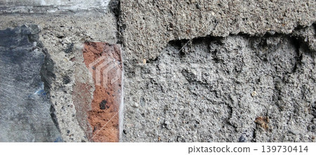Exposed concrete and brick wall texture with rough surface. Exposed concrete and brick wall texture with rough surface. 139730414