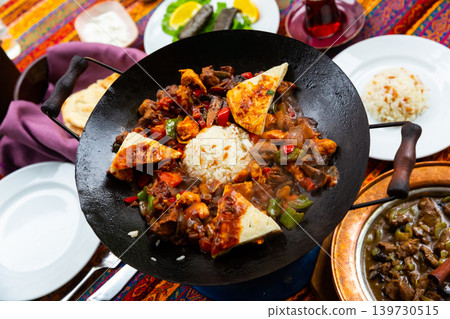 Koban kavurma is a Turkish dish made from fried meat, rice and vegetables. Koban kavurma is a Turkish dish made from fried meat, rice and vegetables. 139730515