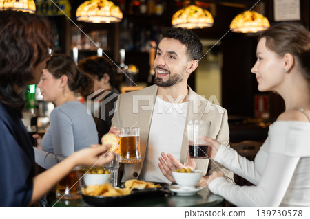 Young people spend time at bar Young people spend time at bar 139730578