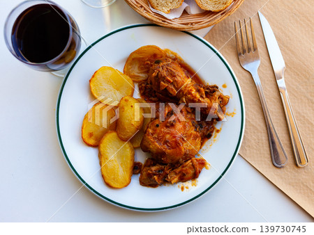 Chicken stewed with vegetables with baked potatoes 139730745