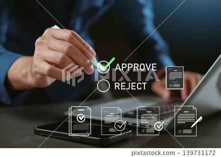 Approval process for digital document management using smartphone and laptop for online workflow, remote work technology promotes paperless office efficiency and virtual approval workflow 139731172