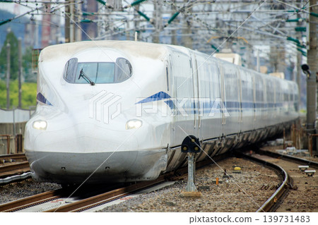 N700S series train passing through Tokuyama Station 139731483