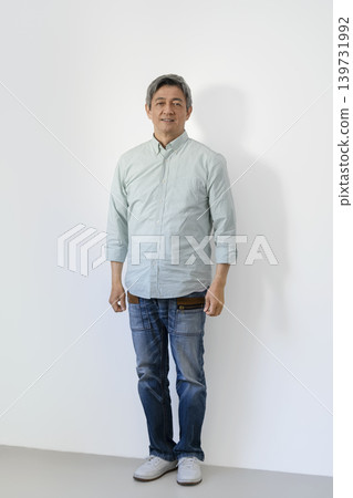 A man in his 60s smiling at the camera A man in his 60s smiling at the camera 139731992