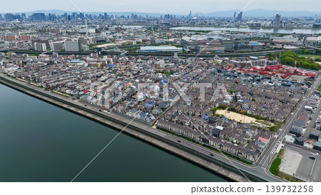 Aerial drone footage of a residential area and roads from directly above. Aerial drone footage of a residential area and roads from directly above. 139732258