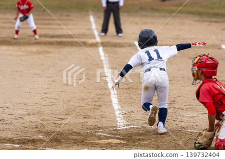 A young baseball player who is working hard to become a professional baseball player A young baseball player who is working hard to become a professional baseball player 139732404
