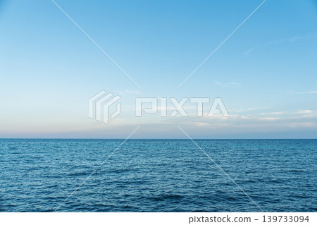 Calm Ocean View with Blue Sky and Horizon, Serene Seascape in Italy for Summer Escape Calm Ocean View with Blue Sky and Horizon, Serene Seascape in Italy for Summer Escape 139733094