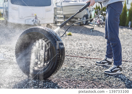 Car Tire Cleaning with Pressure Washer, Automotive Maintenance and Vehicle Care Concept Car Tire Cleaning with Pressure Washer, Automotive Maintenance and Vehicle Care Concept 139733100